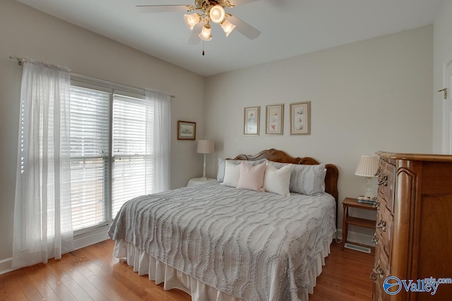 bedroom featuring a ceiling fan and light wood finished floors