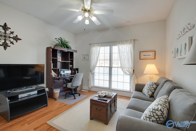 office space featuring wood finished floors and ceiling fan