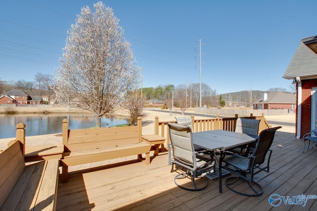 wooden terrace featuring outdoor dining area and fence