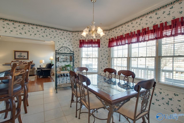 dining room with light tile patterned floors, wallpapered walls, crown molding, and an inviting chandelier