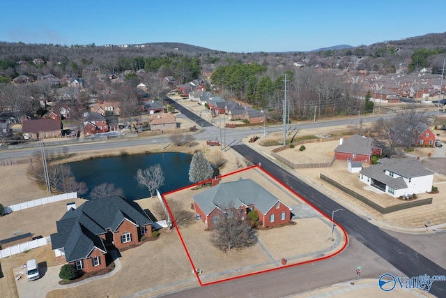 bird's eye view with a residential view and a water and mountain view