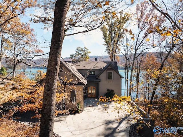 view of front property with a water view