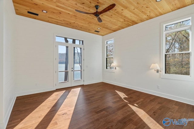 spare room featuring wood-type flooring, ceiling fan, french doors, and wood ceiling