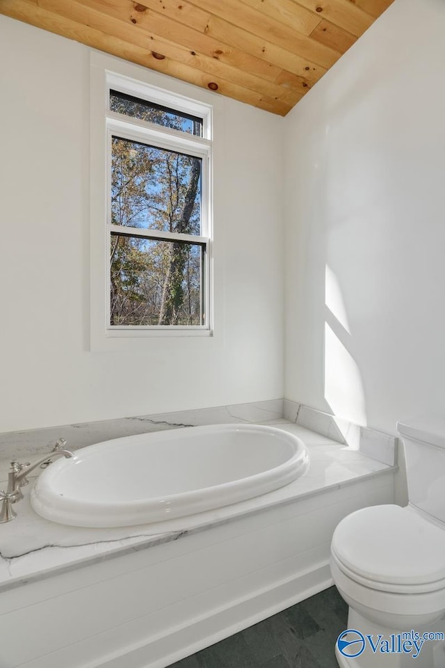 bathroom with a tub to relax in, wood ceiling, and toilet