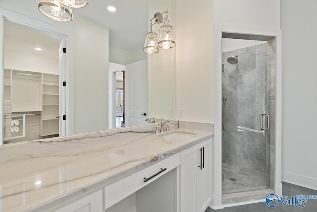 bathroom with tile patterned floors, vanity, and an enclosed shower