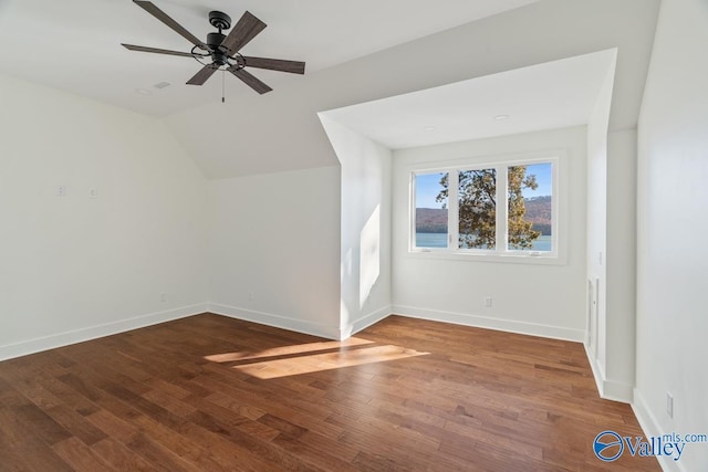 additional living space featuring ceiling fan, lofted ceiling, and hardwood / wood-style flooring