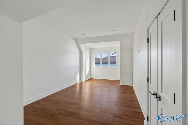 spare room featuring wood-type flooring