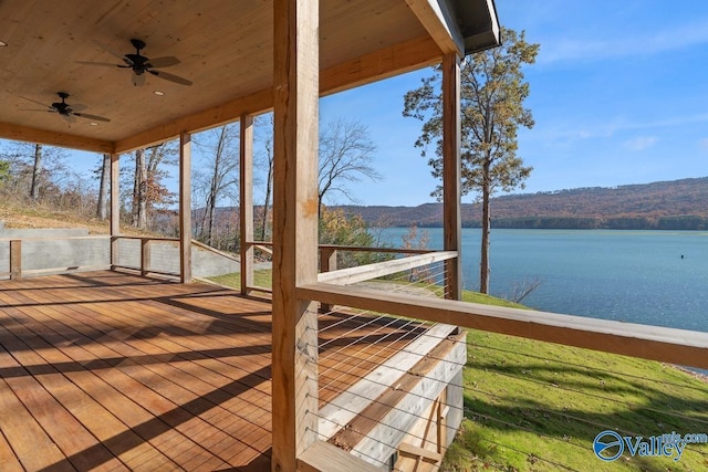 exterior space featuring a water view and ceiling fan