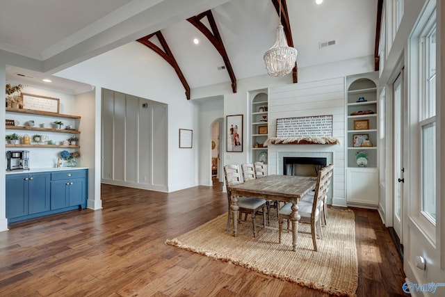 dining space featuring visible vents, dark wood-style flooring, beam ceiling, and a notable chandelier