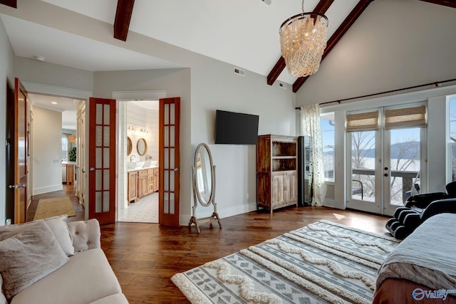 living room with a notable chandelier, high vaulted ceiling, beamed ceiling, french doors, and dark wood-type flooring