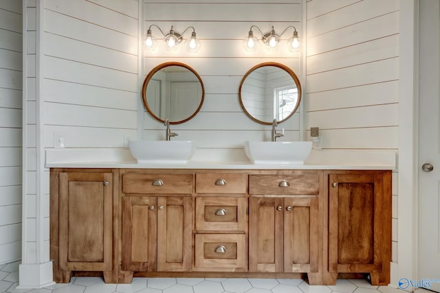 bathroom with dual vanity and tile patterned flooring