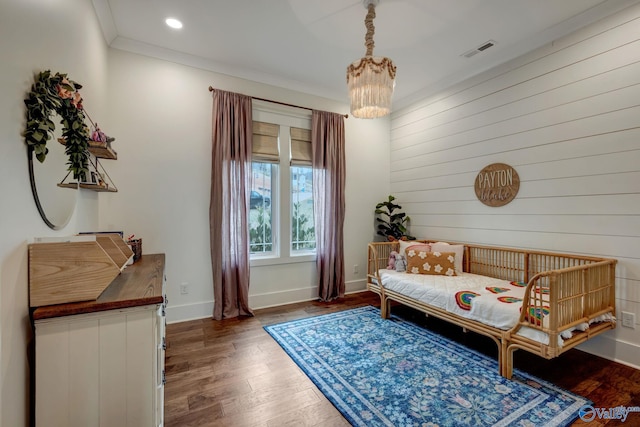 bedroom with recessed lighting, visible vents, baseboards, ornamental molding, and dark wood finished floors