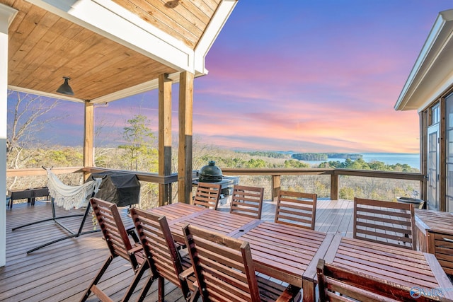 wooden deck with outdoor dining area