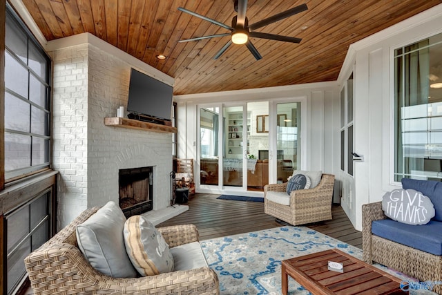 living room with wooden ceiling, ceiling fan, a fireplace, and dark wood-type flooring
