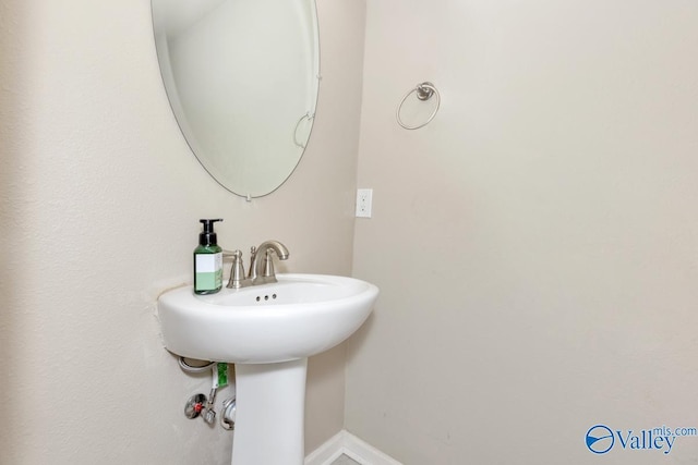 bathroom featuring baseboards