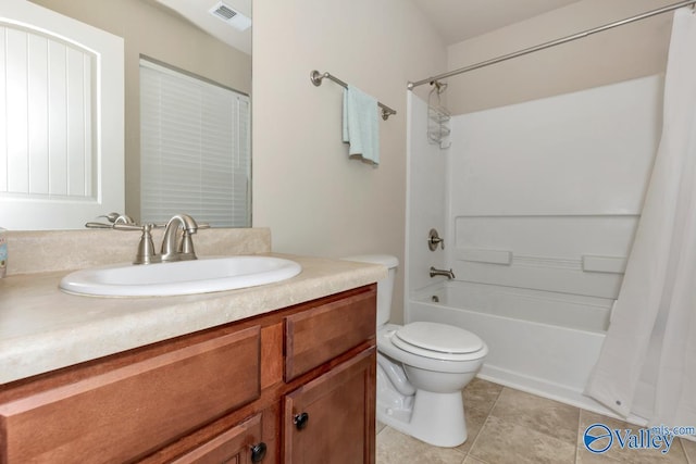 bathroom with visible vents, toilet, shower / bath combo with shower curtain, vanity, and tile patterned flooring