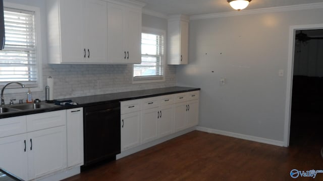 kitchen with crown molding, dark wood-type flooring, sink, black dishwasher, and white cabinetry