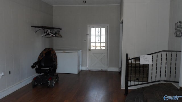 laundry room featuring dark hardwood / wood-style floors and washer / dryer