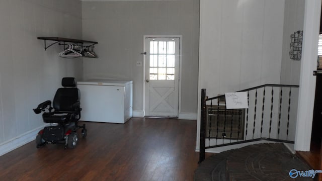 laundry room featuring dark wood-type flooring