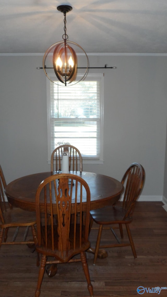 dining space with a notable chandelier, dark hardwood / wood-style flooring, and crown molding