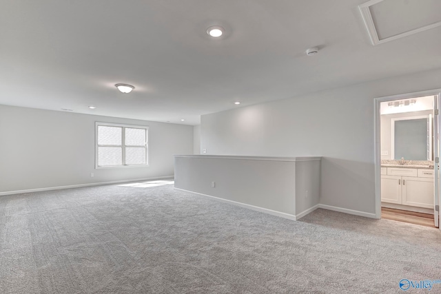 carpeted empty room with sink