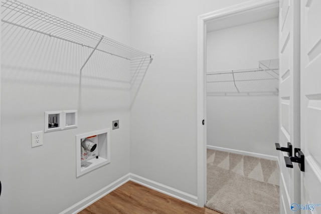 washroom with washer hookup, hardwood / wood-style flooring, and electric dryer hookup