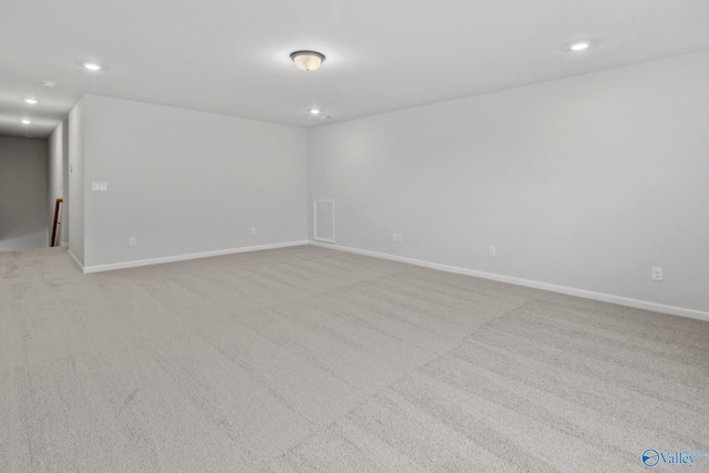 empty room with light colored carpet