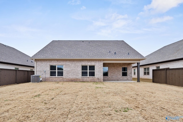 rear view of house featuring cooling unit