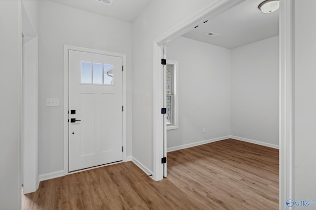 foyer with light wood-type flooring