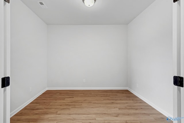 unfurnished room featuring light hardwood / wood-style floors