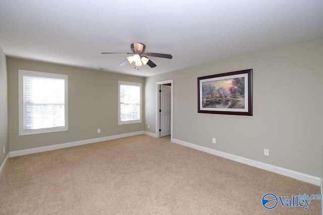 carpeted empty room with ceiling fan