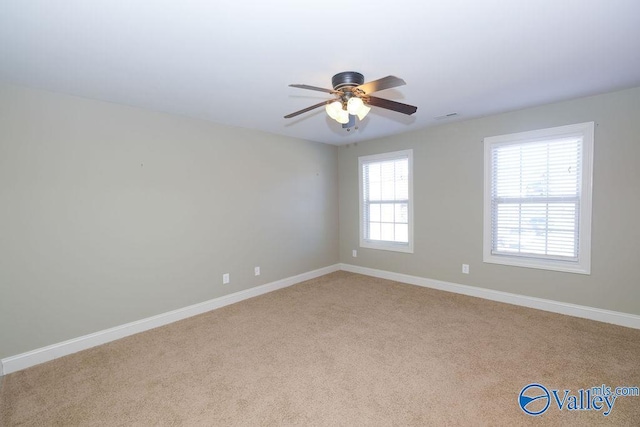 carpeted empty room with ceiling fan