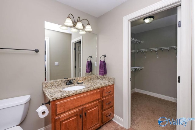 bathroom with toilet and vanity