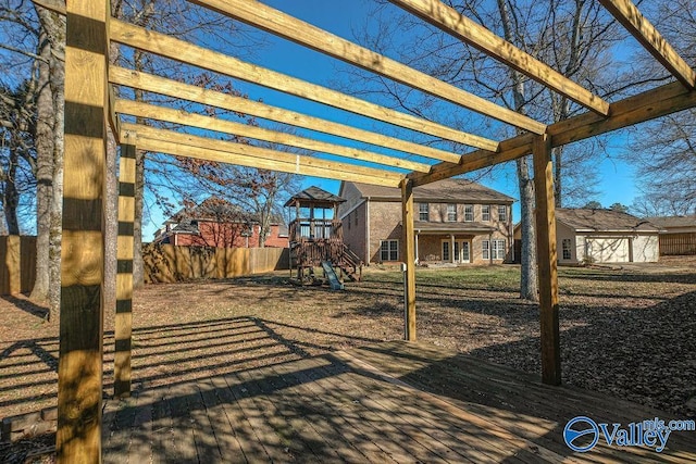 view of patio with a playground, a pergola, a deck, and a storage unit