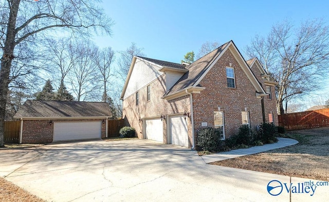 view of side of home featuring a garage