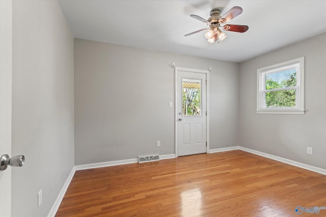 11021 Jean Rd SE, Huntsville, AL 35803 - empty room featuring plenty of natural light, a ceiling fan, visible vents, and light wood-style floors