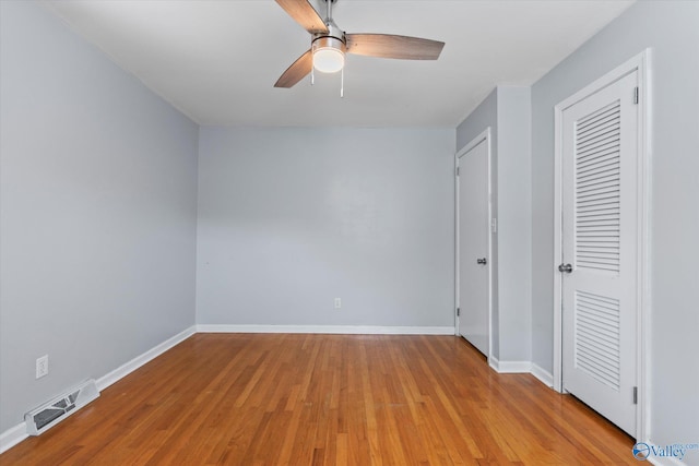 11021 Jean Rd SE, Huntsville, AL 35803 - unfurnished bedroom with baseboards, a ceiling fan, light wood finished floors, and visible vents
