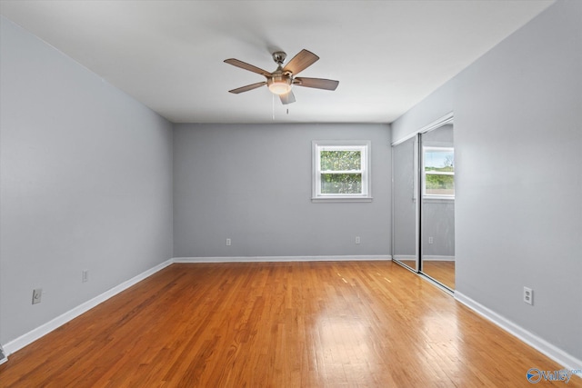 11021 Jean Rd SE, Huntsville, AL 35803 - unfurnished bedroom with light wood-style flooring, a closet, and baseboards