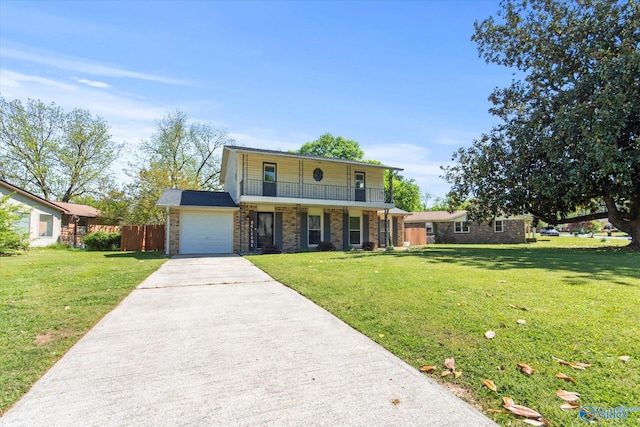 11021 Jean Rd SE, Huntsville, AL 35803 - traditional-style house with concrete driveway, a front lawn, a balcony, and an attached garage