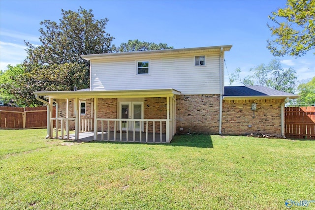 11021 Jean Rd SE, Huntsville, AL 35803 - rear view of property with brick siding, french doors, a lawn, and a fenced backyard