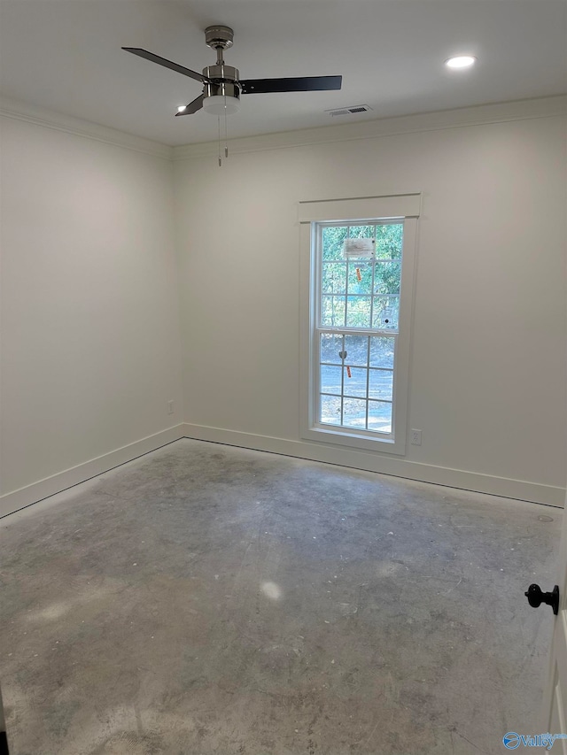 empty room with baseboards, visible vents, unfinished concrete flooring, ceiling fan, and ornamental molding