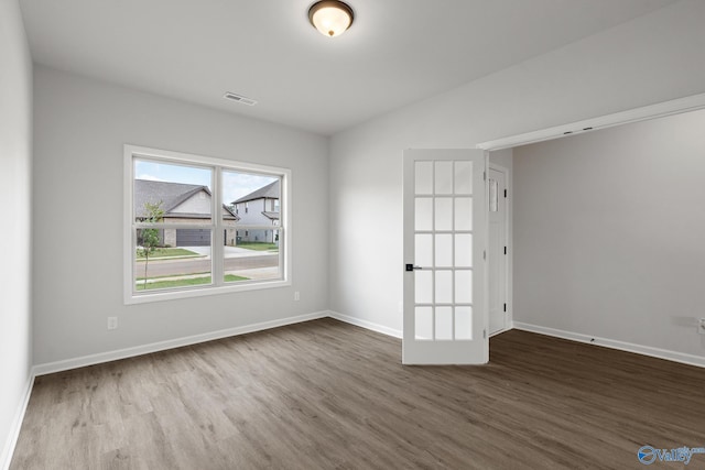 unfurnished room featuring wood-type flooring