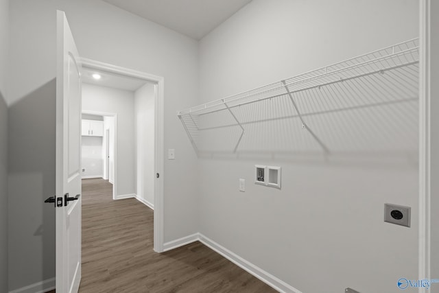 laundry area featuring hookup for a washing machine, electric dryer hookup, and dark hardwood / wood-style flooring