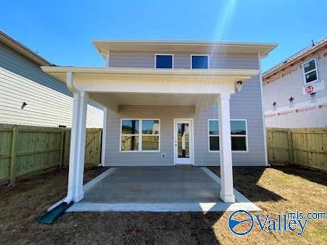 back of property with a patio area