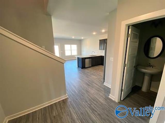 hall featuring sink and dark hardwood / wood-style flooring