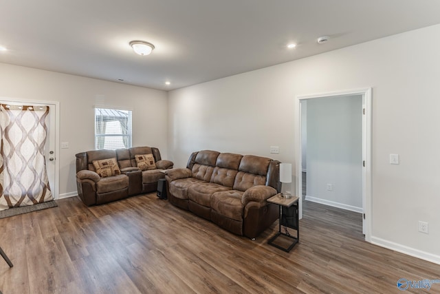 living room with dark hardwood / wood-style floors