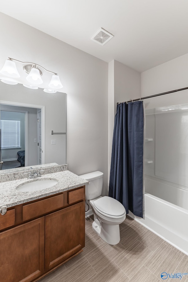 full bathroom featuring vanity, toilet, and shower / bath combo with shower curtain