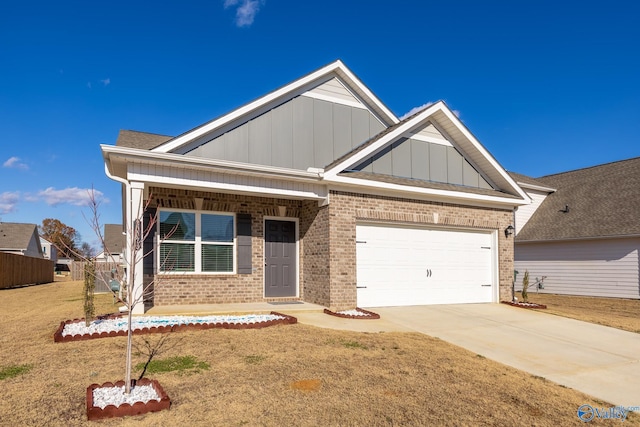 craftsman inspired home with a garage and a front lawn