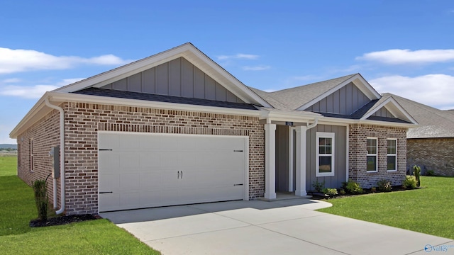 174 Foundry St, Huntsville, AL 35811 - view of front of home with brick siding, board and batten siding, and an attached garage