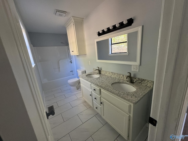 full bathroom with vanity, bathtub / shower combination, and toilet